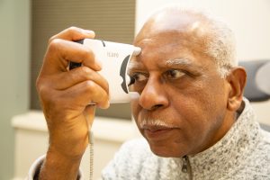 Patient uses tonometer to measure eye pressure_Glaucoma Awareness 2021