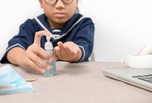 Asian Girl Using Wash Hand Sanitizer Gel Pump Dispenser, Washing