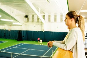 Neuro-optometrist Dr. Anne Reuter-Hanna, ’08, courtside at the John McEnroe Tennis Academy.