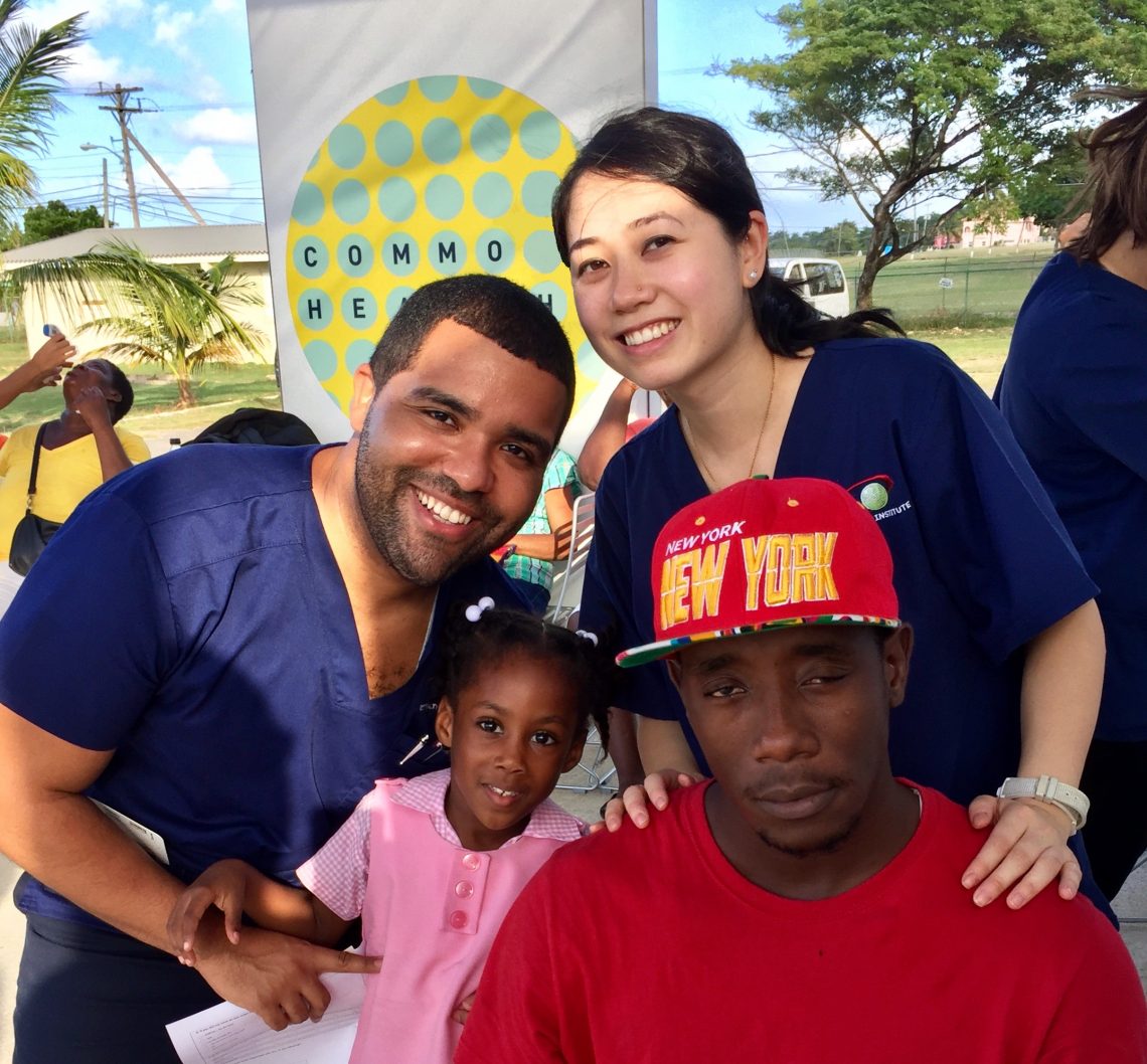 Dr. Jennifer Hue (standing, right) and Christian Alberto with patients in Hanover, Jamaica